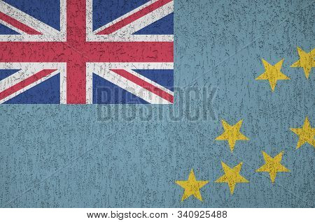 Tuvalu Flag Depicted In Bright Paint Colors On Old Relief Plastering Wall. Textured Banner On Rough 