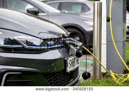 Glasgow, Scotland - July 31, 2019: The Volkswagen Golf Gte Electric Car Charged At The Public Chargi