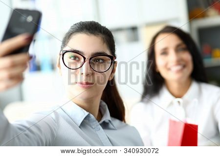 Portrait Of Beautiful Businesswoman Taking Photo With Colleague. Wonderful Businesslady With Black L