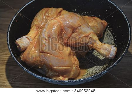 Cooking Chicken In White Sauce, In The Marinade. Smearing Dark Hands With Mayonnaise Or Seasonings C