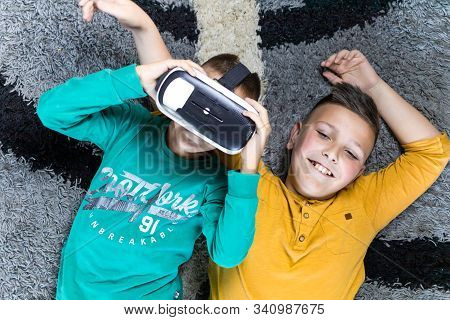 Cute, Little Boy Having Fun With Vr Headset With His Brother Next To Him. Kids And Technology Concep