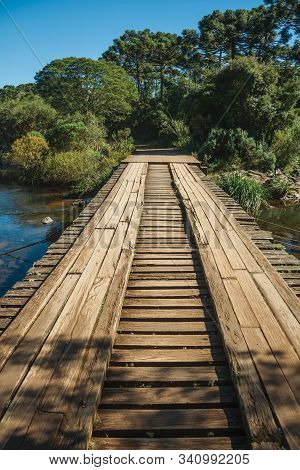Wooden Bridge Over Creek And Trail Through Forest At The Aparados Da Serra National Park Near Cambar