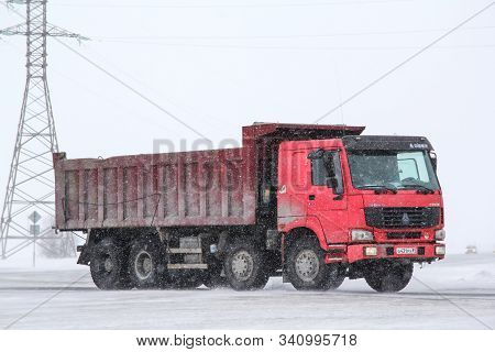 Novyy Urengoy, Russia - April 7, 2013: Red Chinese Dump Truck Cnhtc Howo Sinotruk At The Interurban 