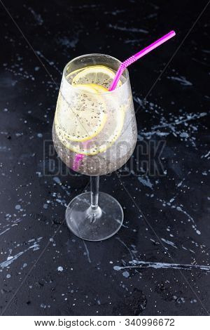 Glass Of Fresh, Cold Water With Chia Seeds And Lemon Slices, Refreshing And Hydrating Summer Drink