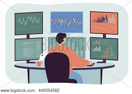Man Sitting At Desk With Computers In Office. Stock Trader Or Broker Looking At Multiple Screens Wit