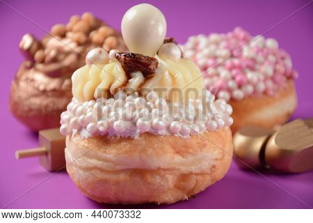 Donuts(sufgania) And Dreidal - Jewish Holiday Hanukkah Symbols. Fresh Donuts For Hanukkah Celebratio