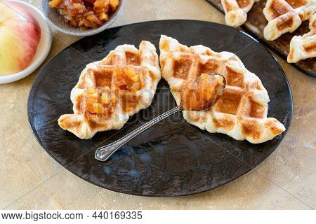 Croffle Is An Asian Delicacy Made Of Puff Pastry With Apple Jam. Delicious Waffles On A Ceramic Plat