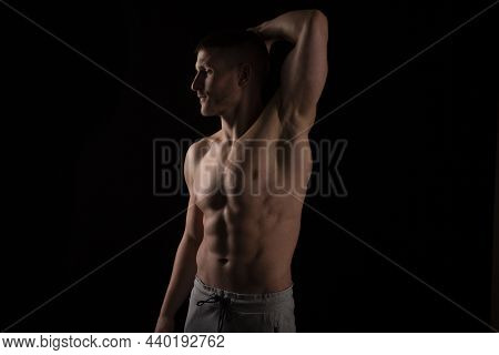 Man Showing Abs. Muscle Man Posing. Strong Body Concept. Topless Sport Man Bodybuilder. Six Pack Spo