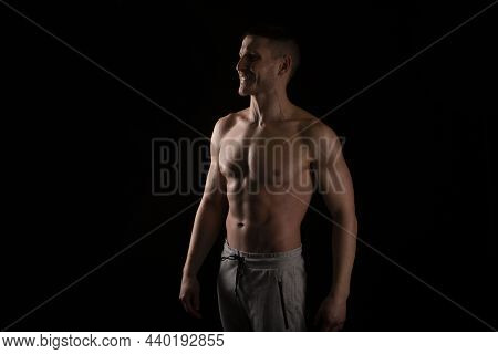 Man Showing Abs. Muscle Man Posing. Strong Body Concept. Topless Sport Man Bodybuilder. Six Pack Spo