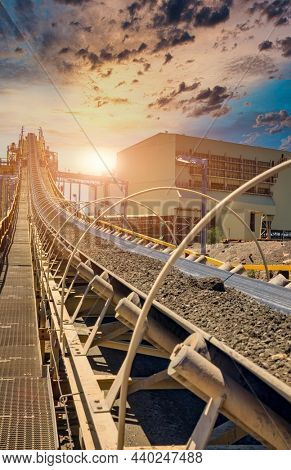 a huge conveyor belt at the sunset in a diamond mine in Botswana