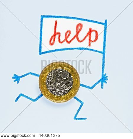 1 One Pound Coin Lies On Light Blue Backdrop. It Runs With A Flag On Which The Word Help Is Written.