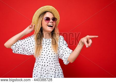Portrait Of Beautiful Fascinating Emotional Positive Joyful Happpy Female Promoter Pointing To The S