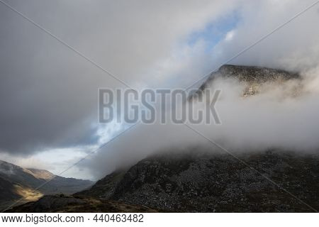 Epic Mountain Landscape Image Of Pen Yr Ole Wen In Snowdonia National Park With Low Cloud On Peak An