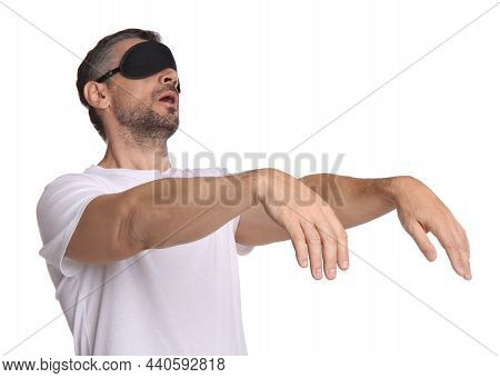 Man With Eye Mask In Sleepwalking State On White Background