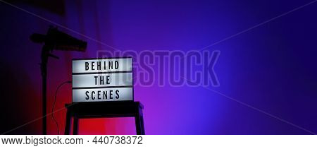 Movie Board Light Box On Studio Stair And Light Snoot Tripod On Colors Gradiant Background.