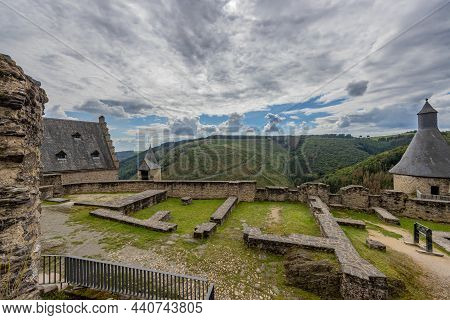 Outdoor Ruin At The Medieval Castle Of Bourscheid, Ruined Stone Walls, Towers, Roofs And The Valley 