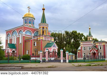 Bright Architecturally Decorated Facade In Russian Traditional Style Under A Cloudy Sky. Abakan, Sib