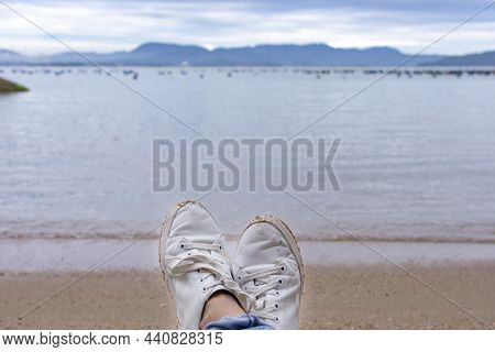 White Sneakers On The Background Of The Sea, Governador Celso Ramos, Welcome Beach, Santa Catarina,