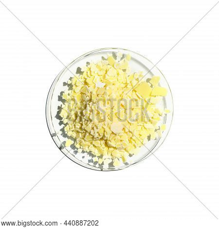 Closeup Chemical Ingredient On White Laboratory Table. Sodium Sulfide Flake In Chemical Watch Glass.