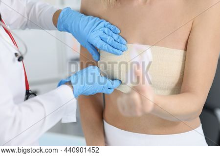 Close-up Of Doctor Examine Woman Breast And Palping It Carefully On Appointment. Client Hold White R