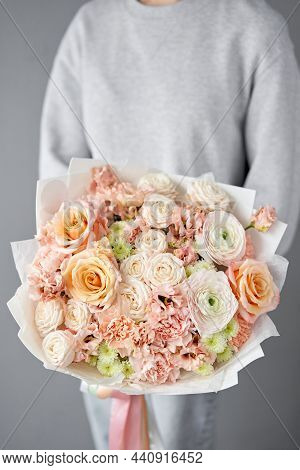 Flower Arrangement In Wicker Basket. Beautiful Bouquet Of Mixed Flowers In Woman Hand. Handsome Fres