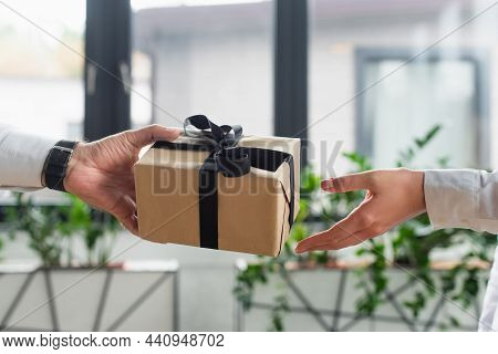 Cropped View Of Businessman Giving Gift Box To Woman In Office, Anti-corruption Concept