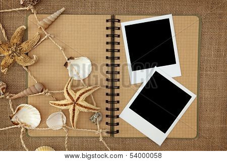 Fishing net and exercise book on brown background