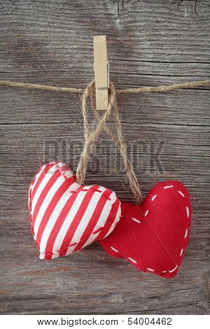 Red hearts on wooden background