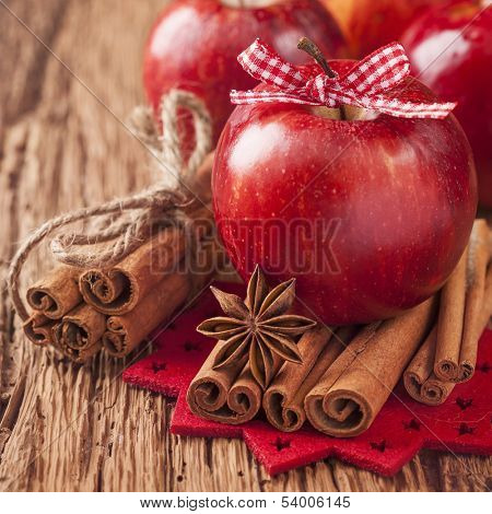 Red winter apples with cinnamon sticks and anise