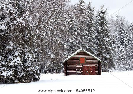 A red and green log shed