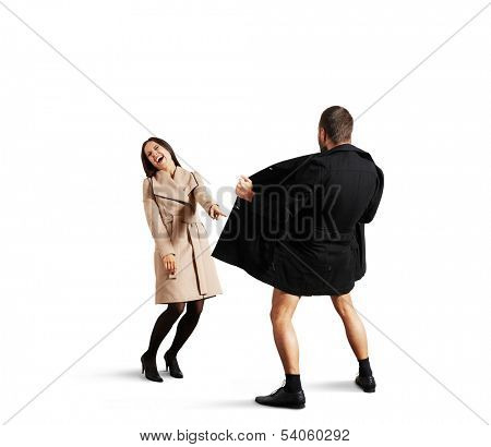 young woman laughing at the exhibitionist man. isolated on white background