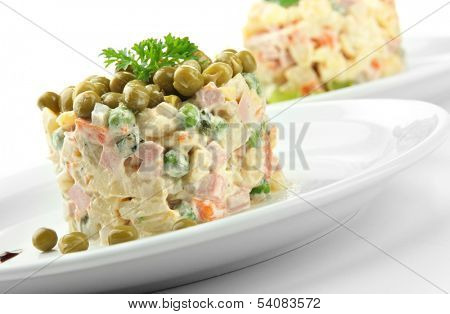 Russian traditional salad Olivier, isolated on white