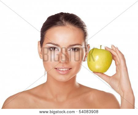 A portrait of beautiful young woman with a green apple on her hand - on white background