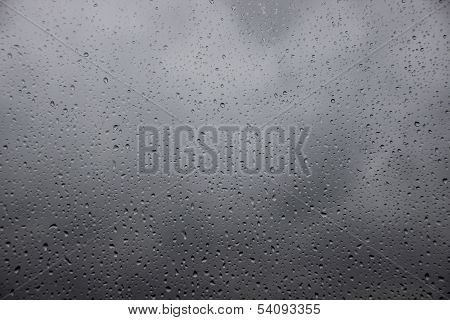 Raindrops On A Window With Heavy Rain Outside