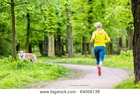 Woman Running In Summer Park