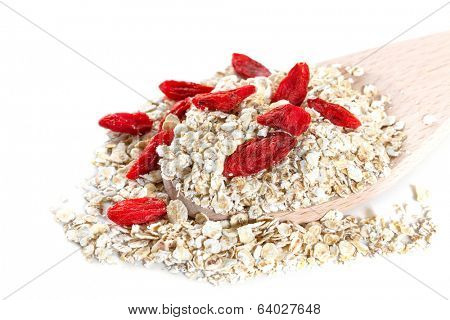 Oat flakes with goji berries on white background