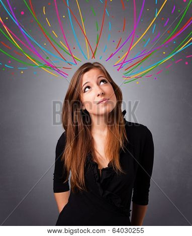 Pretty young girl thinking with colorful abstract lines overhead