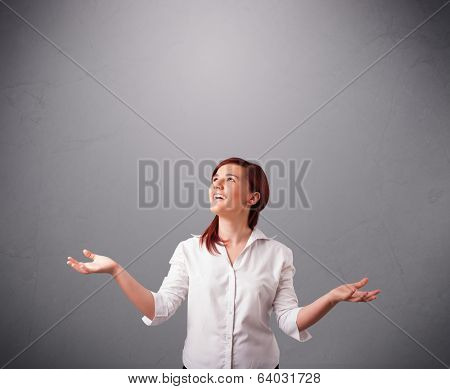 beautiful young lady standing and juggling with copy space