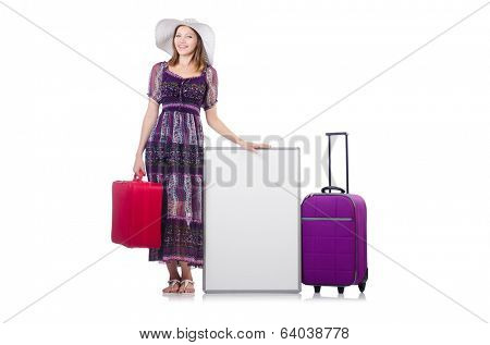 Woman in panama  preparing for travel  with suitcases and blankboard  isolated on white
