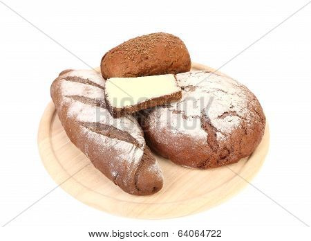 Various healthy bread on a wooden tray.