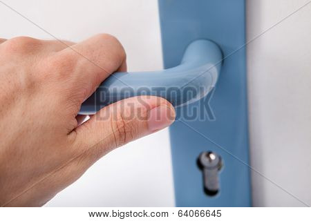 Hand Opening The Door Handle