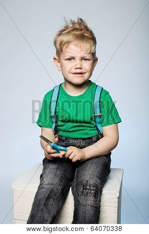 Naughty child with scissors