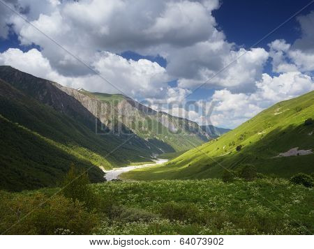 Summer landscape with river in a mountain valley. View from the beautiful sky above the mountains. Zemo Svanetii, Georgia, Caucasus