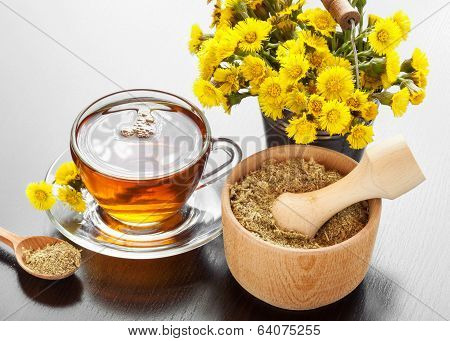 Healthy Tea, Bucket With Coltsfoot Flowers And Mortar On Table
