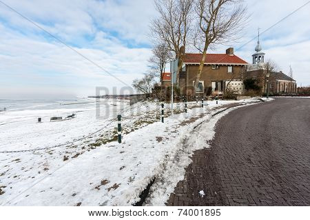 Coast Of Dutch Village Urk In Wintertime With Church And Houses