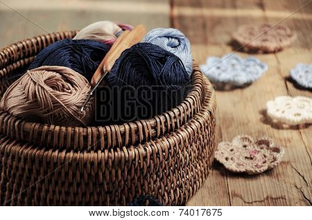Box Of Yarn And Crocheted Flowers