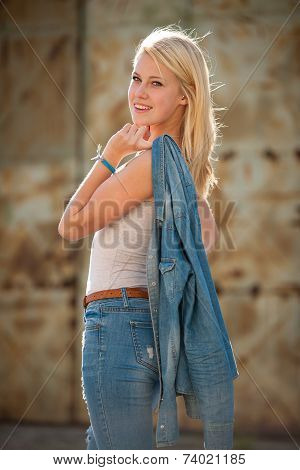 Young Blonde Caucasian Girl Alone On A Street
