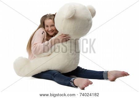 Portrait of girl hugging teddy bear