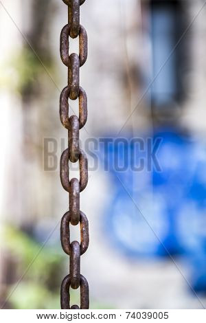 Rusty Chain With Grafitti Bokeh