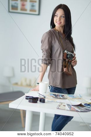 Woman is a proffessional photographer with camera